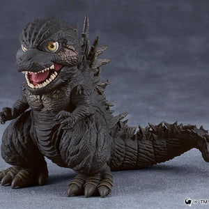 Standing display pose of the Godzilla Minus One 2023 Nendoroid figure with detailed dark textured skin against a dark gray background.