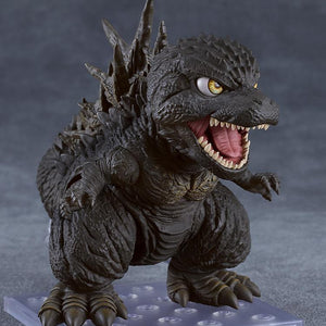 Three-quarter view of the Godzilla Minus One Nendoroid standing on its clear square display stand with an open mouth.