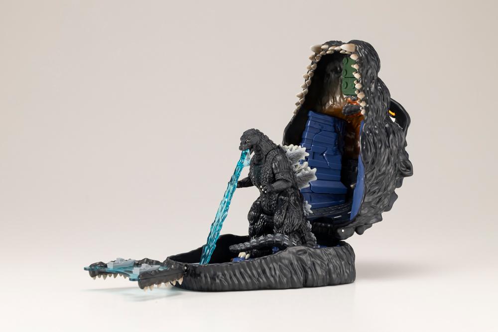 Godzilla pocket playset with blue atomic heat ray effect firing onto the fold-out water ramp.