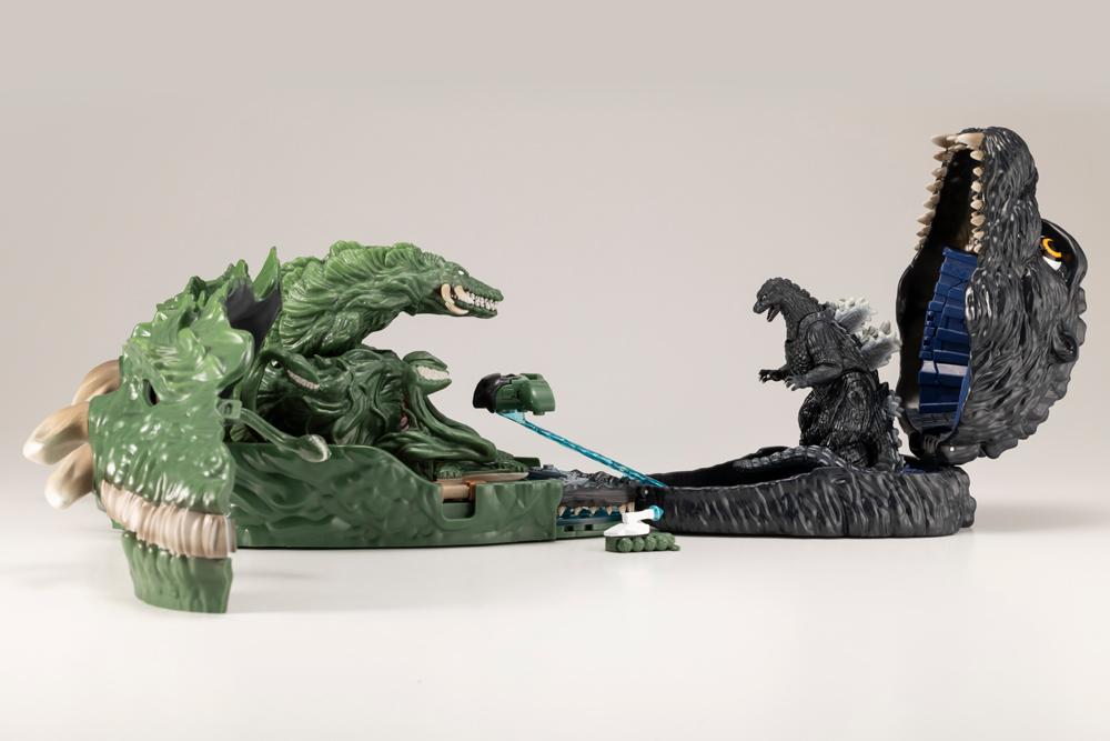 Connected Godzilla and Biollante pocket playsets facing off in a side-by-side battle diorama.