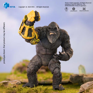 Low-angle dynamic stance of HIYA Exquisite Basic Kong figure raising his B.E.A.S.T. Glove arm in nature setting.