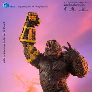HIYA Exquisite Basic Kong figure roaring and raising B.E.A.S.T. Glove fist high against a vibrant purple sunset.