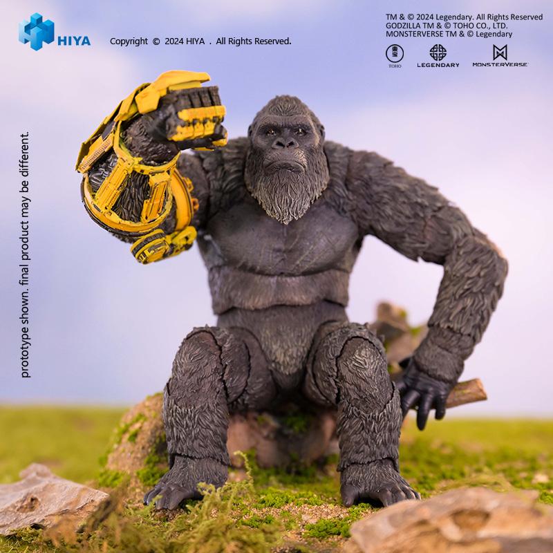 HIYA Exquisite Basic Kong action figure seated on a rock showcasing the detailed yellow armor gauntlet.