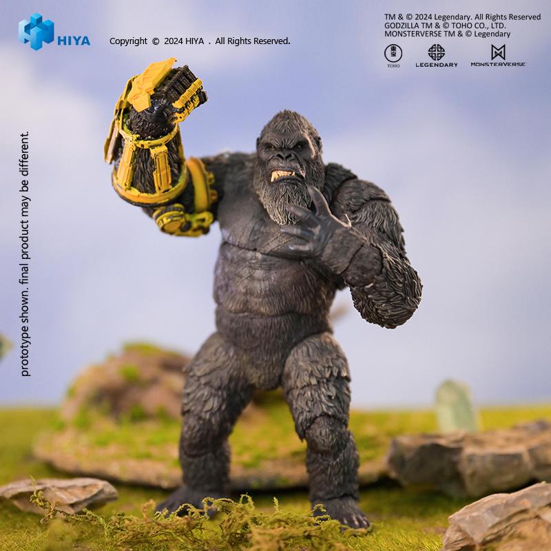 Front view of HIYA Exquisite Basic Kong action figure with yellow B.E.A.S.T. Glove in a combat stance on mossy ground.