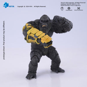 Front studio shot of HIYA Exquisite Basic Kong action figure punching forward with B.E.A.S.T. Glove on plain background.
