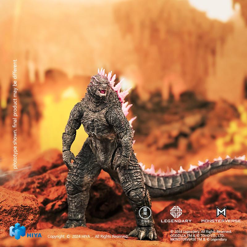 Full body action pose of HIYA Exquisite Basic Godzilla Evolved figure set against a fiery volcanic rock background.
