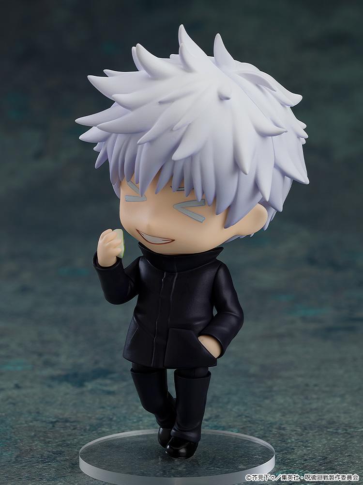 Playful pose of the Satoru Gojo Nendoroid figure showcasing a cheerful smiling face plate with stylized blue anime expression lines.