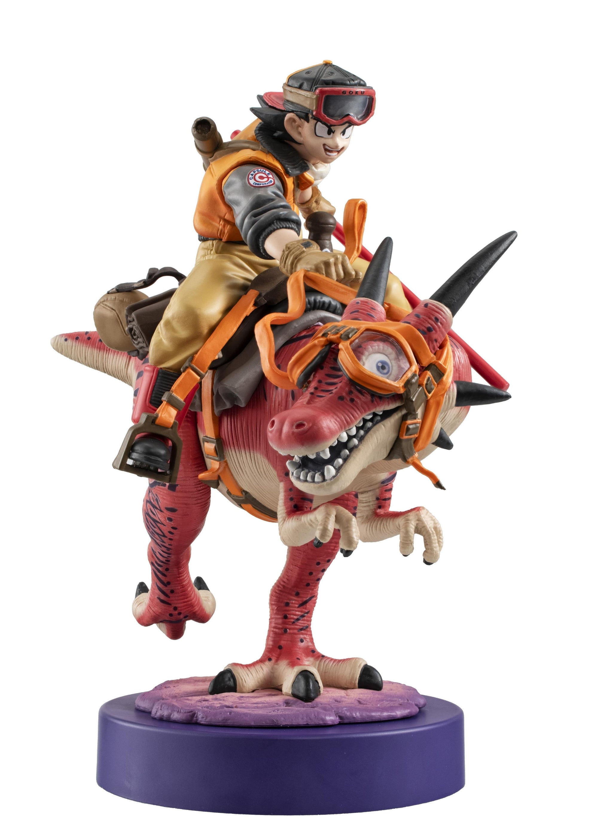 Close-up angled front view of the Son Goku 01 figure, showing the dinosaur's goggles and Goku's determined expression.
