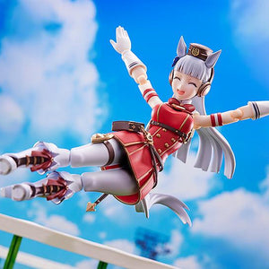 Gold Ship action figure performing her signature mid-air dropkick pose against a blue sky background.