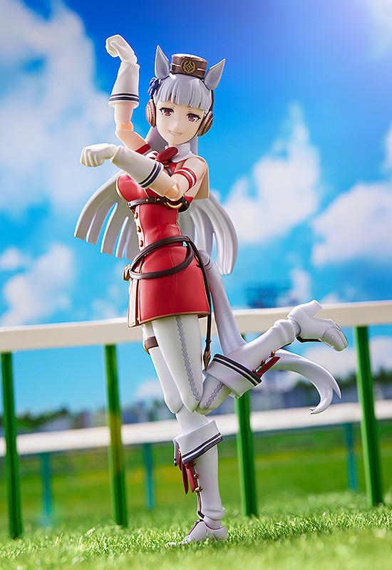 eccentric and fun-loving Gold Ship figma in a humorous pose at the race track diorama.