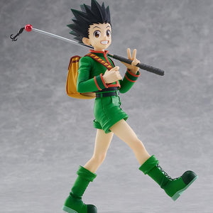 Full-body studio product display of the non-articulated Gon Freecss L size figure by Good Smile Company standing on a clear circular base against a light gray background.