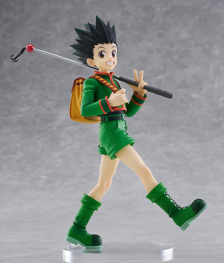 Full-body studio product display of the non-articulated Gon Freecss L size figure by Good Smile Company standing on a clear circular base against a light gray background.