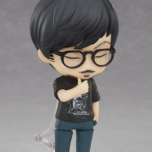 Hideo Kojima Nendoroid figure displaying closed-eye thinking faceplate with hand resting on chin.