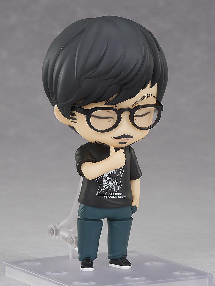 Hideo Kojima Nendoroid figure displaying closed-eye thinking faceplate with hand resting on chin.