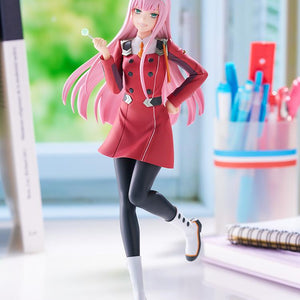 Wide lifestyle display photo of the Good Smile Company Pop Up Parade L Zero Two figure set up on a study desk next to books and stationery.