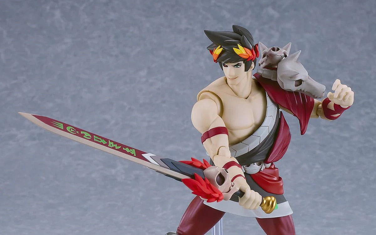Close-up of the Zagreus figma figure, displaying the swappable "smirking" face plate and holding the Stygian Blade ready to strike.