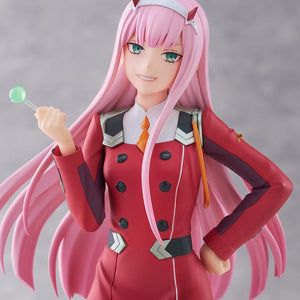 Close-up portrait of Zero Two showcasing her mischievous smile, red horns, green eyes, and lollipop from Darling in the Franxx.