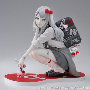 Full front studio view of the Junji Ito G.S. Collection Gyaru Tomie x Hello Kitty figure crouching in a school uniform on a red bow base.