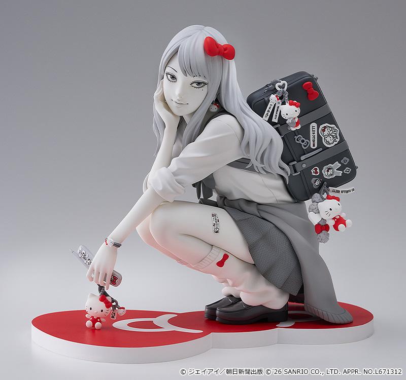 Full front studio view of the Junji Ito G.S. Collection Gyaru Tomie x Hello Kitty figure crouching in a school uniform on a red bow base.