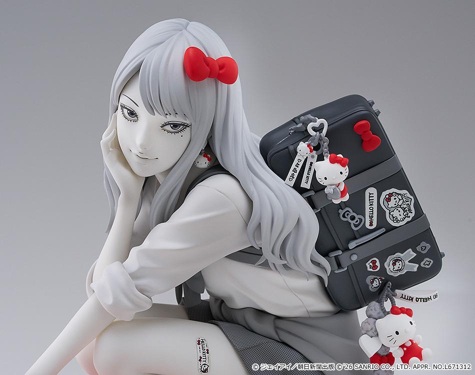 Detailed portrait close-up of Gyaru Tomie featuring her beauty mark, Hello Kitty earring, red ribbon, and sticker-covered school bag.