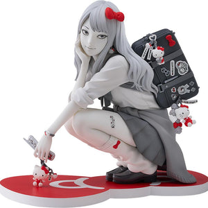 Isolated product cutout of the Good Smile Company Junji Ito G.S. Collection Gyaru Tomie x Hello Kitty figure crouching on a red bow display base.