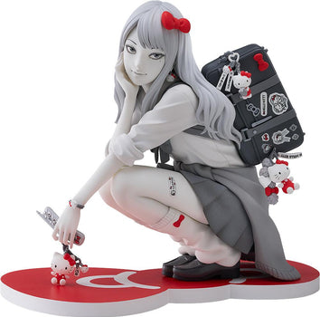 Isolated product cutout of the Good Smile Company Junji Ito G.S. Collection Gyaru Tomie x Hello Kitty figure crouching on a red bow display base.