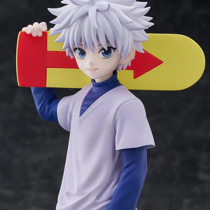 A close-up of the Killua Zoldyck figure, focusing on his smiling face and the red and yellow arrow design on the skateboard accessory.