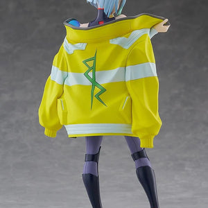 Rear view of the Lucy figure, showcasing the intricate sculpt of the yellow jacket and the gradient colors of her hair.