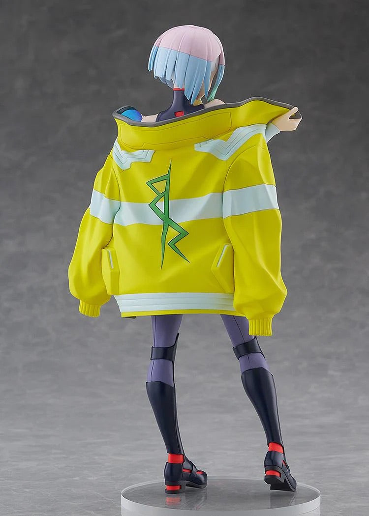 Rear view of the Lucy figure, showcasing the intricate sculpt of the yellow jacket and the gradient colors of her hair.
