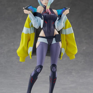 Full frontal studio shot of the Lucy figure, showcasing her pose, cybernetic legs, and multi-colored hair without any background effects.