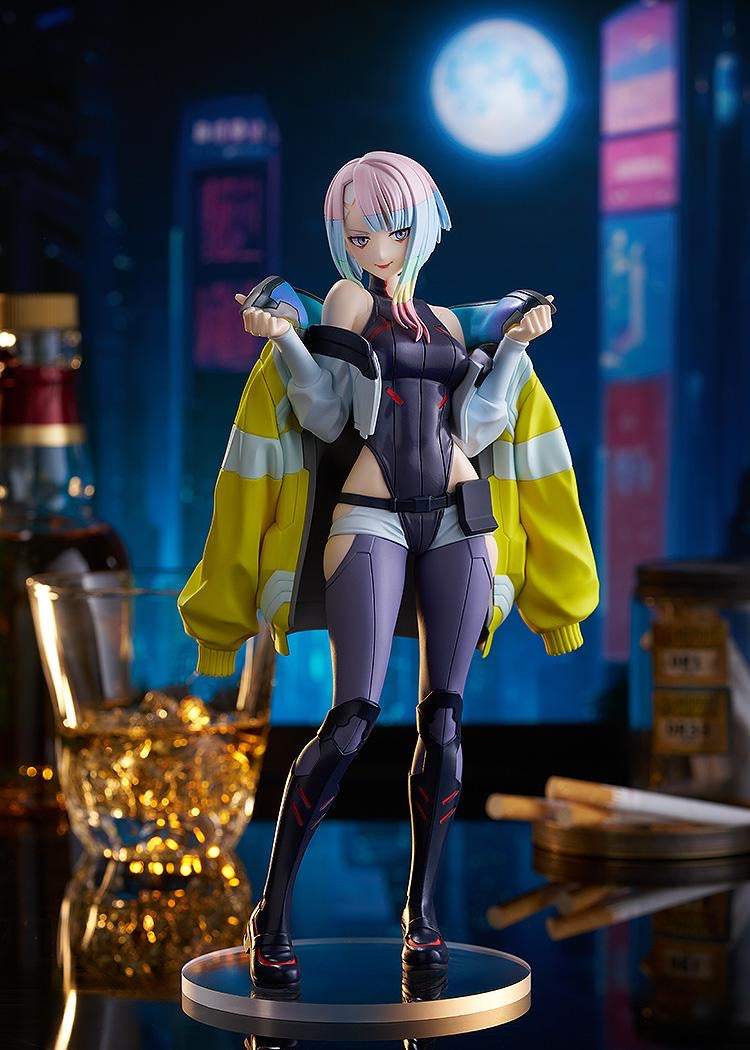 The Lucy figure standing on a mirrored base in a dramatic Night City bar diorama scene with neon lights and a full moon background.