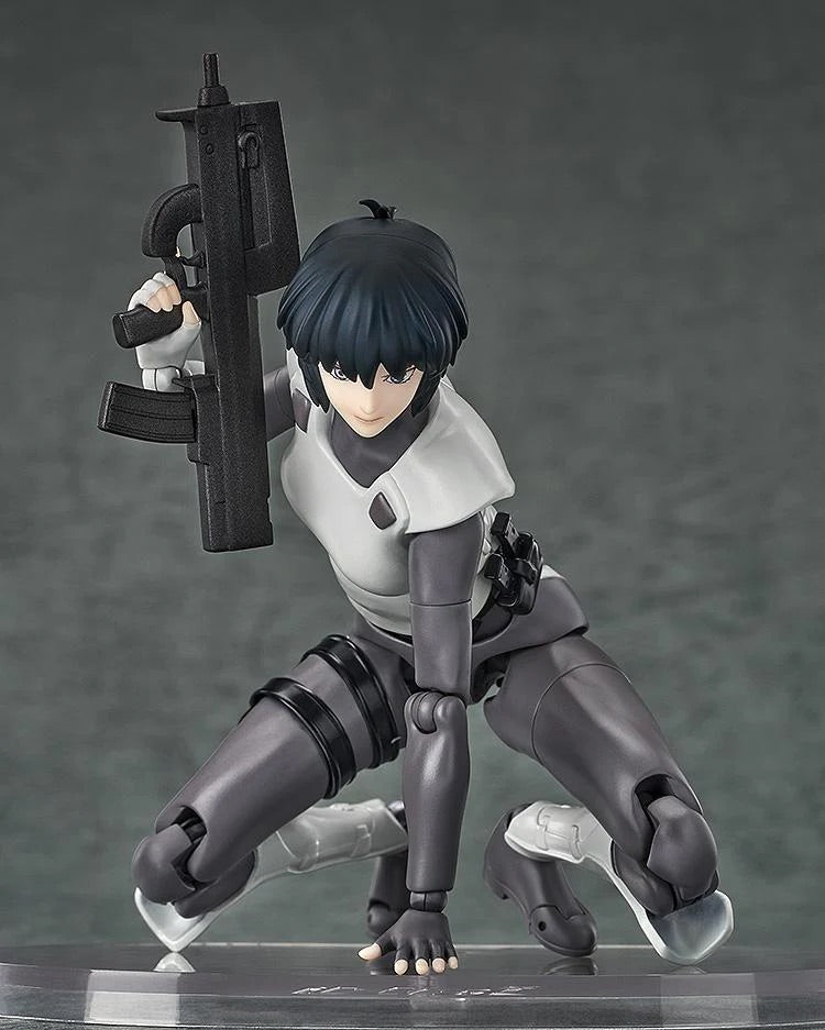 Motoko Kusanagi figure in a deep kneeling/crouching position, aiming her submachine gun, demonstrating the figure's hyper articulation.