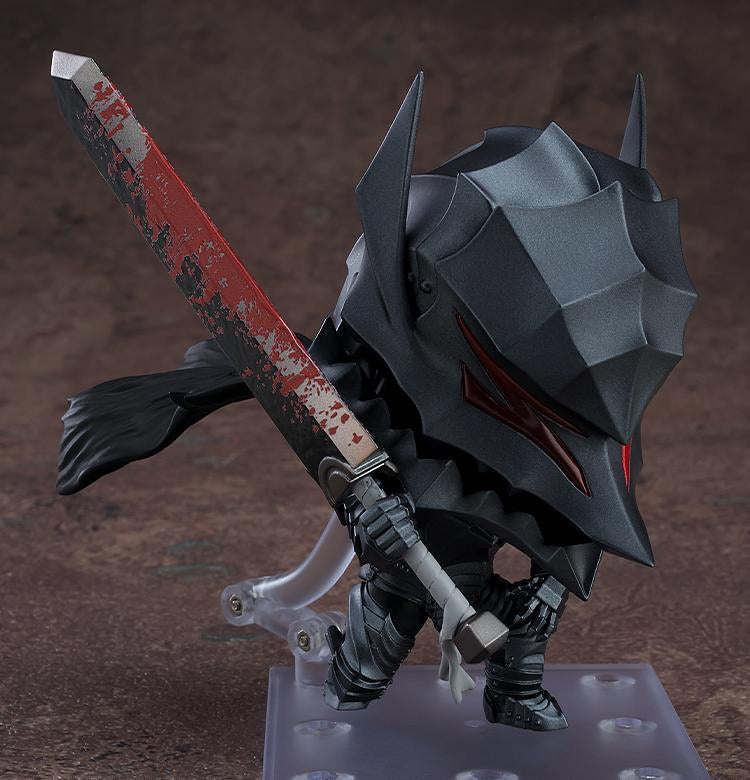 The Guts Nendoroid figure posed low in the Berserker Armor, holding the bloodied Dragon Slayer sword close to his body.
