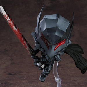 A close-up of the Guts Nendoroid figure's Berserker Armor helmet, highlighting the textured dark gray finish and the red eyes/visor.