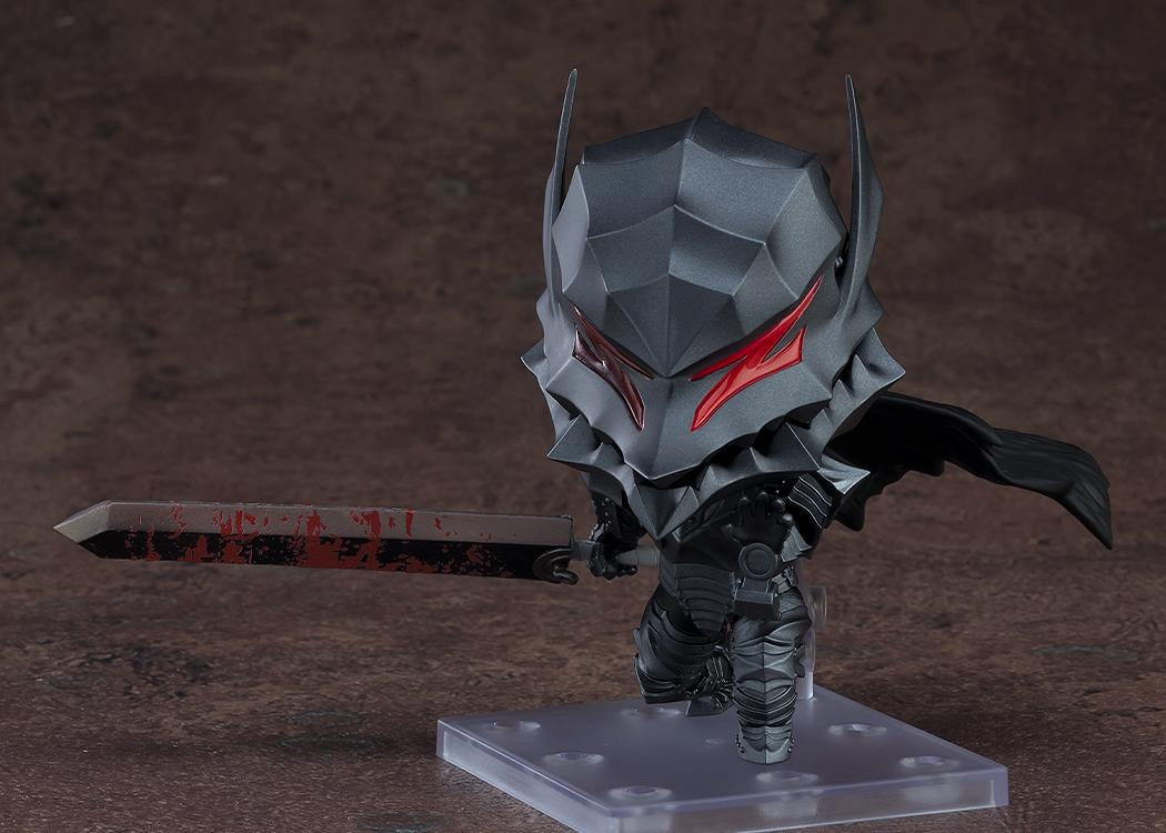 The Guts Nendoroid figure in the Berserker Armor, holding the Dragon Slayer sword, emphasizing the painted blood splatter effect on the blade.