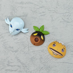 A display of the three transformation mask accessories: the blue Zora Mask, the Deku Mask, and the yellow Goron Mask.
