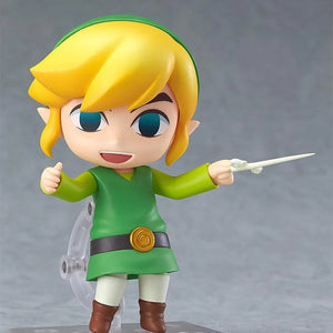 The Nendoroid Link figure featuring the cheerful smiling face plate, posed holding the Wind Waker baton accessory.