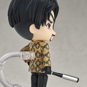 Side profile of the Majima Nendoroid figure, highlighting his hairstyle, eyepatch, and the bat tucked under his arm.