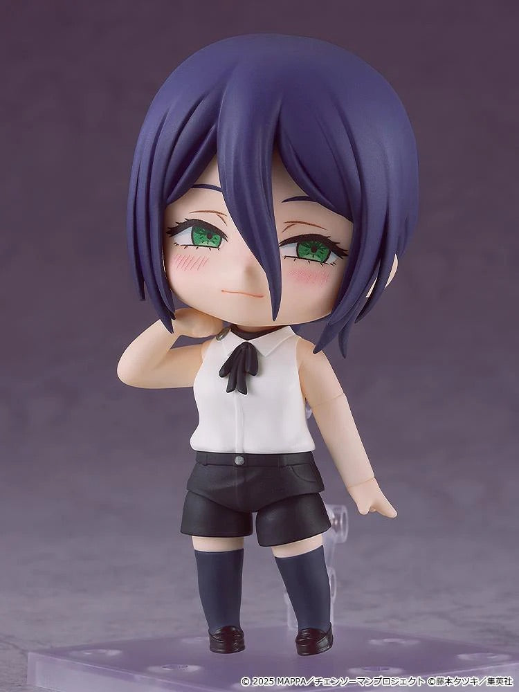 The Reze Nendoroid figure posed with one hand lifted to her cheek, featuring a charming, slightly coy expression.