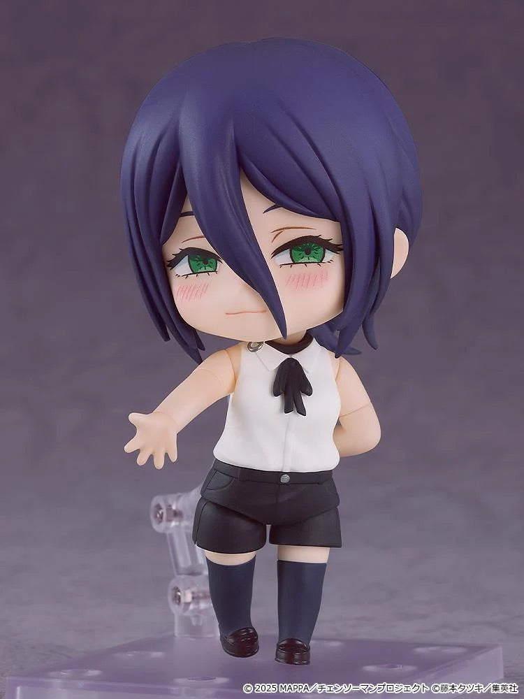 The Reze Nendoroid figure with a sweet expression and slight blush marks, posed with one hand behind her back.