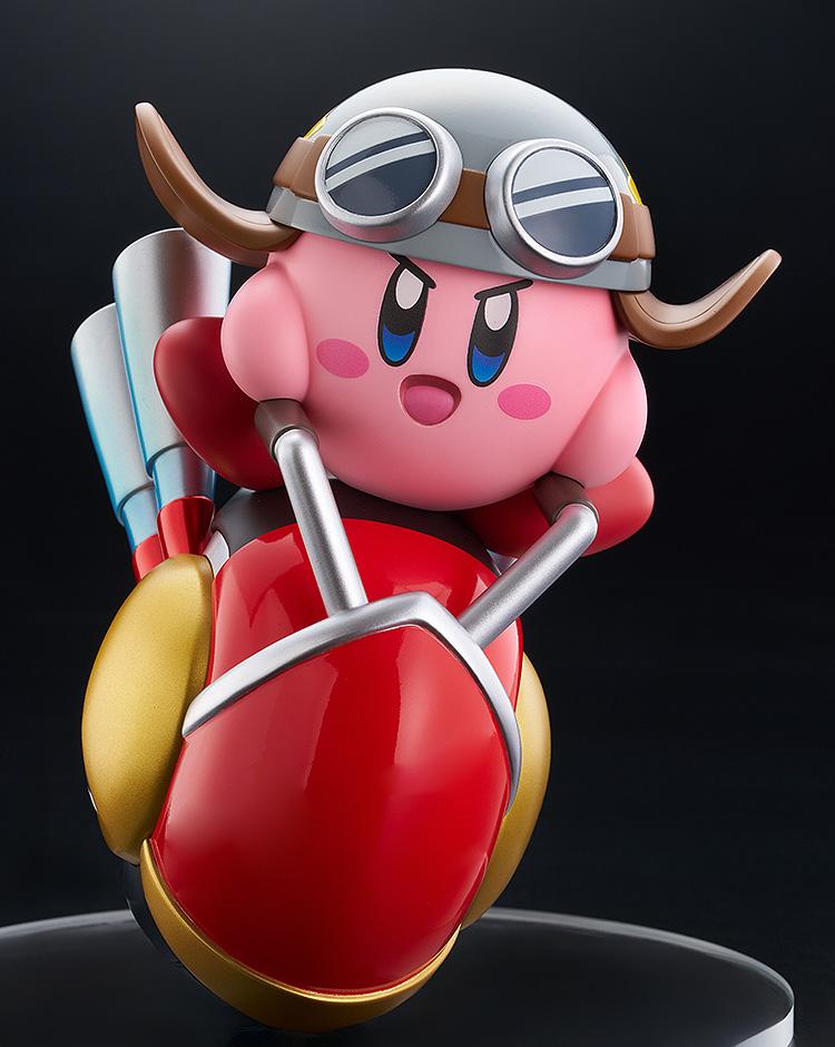Close-up front view of the Kirby Wheelie Rider figure isolated on a black background, capturing the vibrant colors and detailed sculpt of the Good Smile collectible.