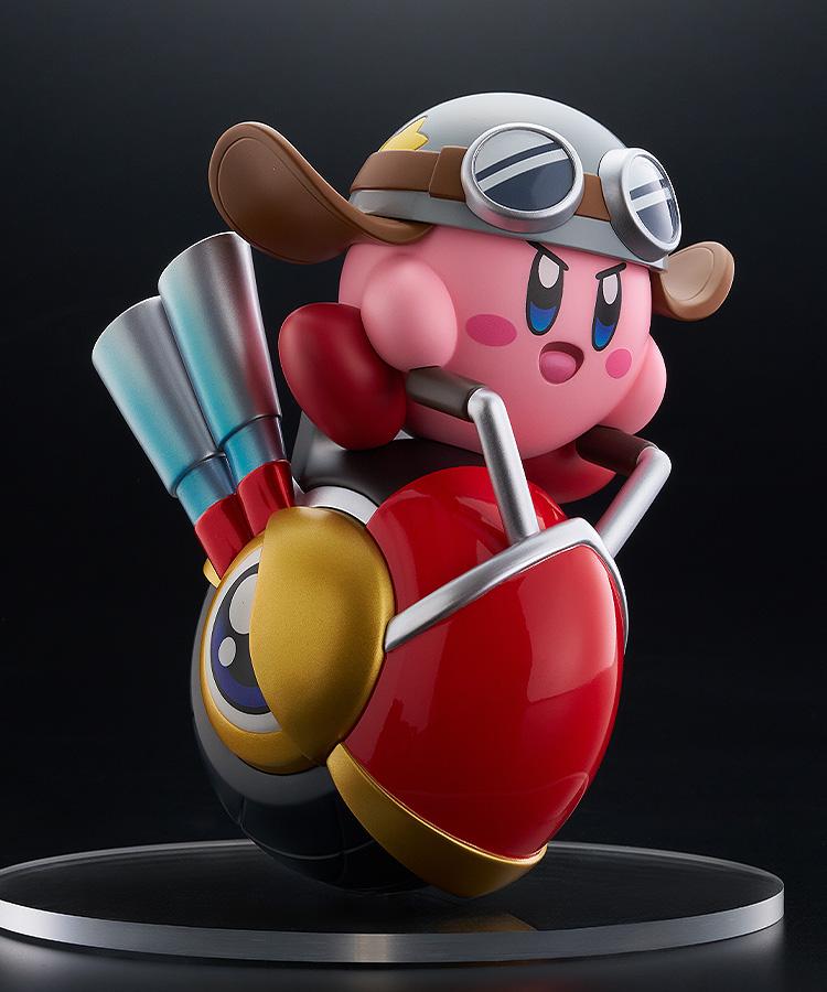 Front-right view of the Kirby Wheelie Rider figure displayed on a clear circular base against a solid black studio background.