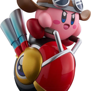 Front-right angle view of the Good Smile Pop Up Parade Kirby Wheelie Rider figure on a clean white background, showing Kirby in a grey helmet riding the red Wheelie enemy.