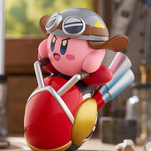 Front-left angle of the Kirby Wheelie Rider figure by Good Smile Company, displaying Kirby's determined expression while holding the silver handlebars.