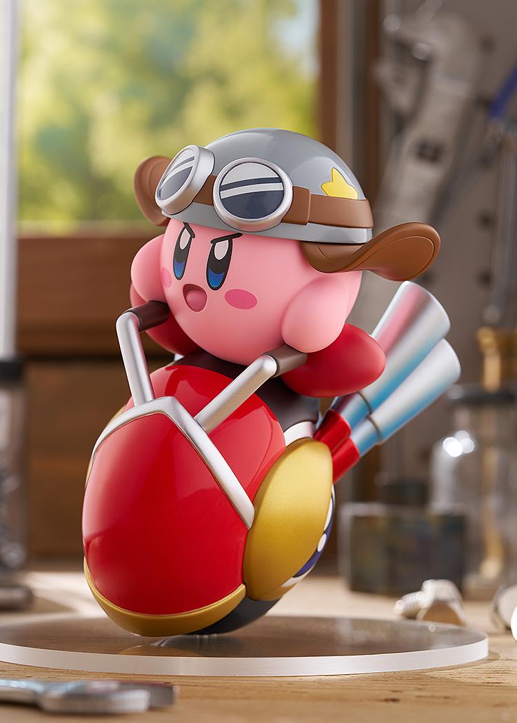 Front-left angle of the Kirby Wheelie Rider figure by Good Smile Company, displaying Kirby's determined expression while holding the silver handlebars.