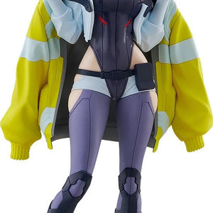 Full frontal view of the Good Smile POP UP PARADE L Lucy Figure, pulling down her iconic yellow jacket with a smirk.