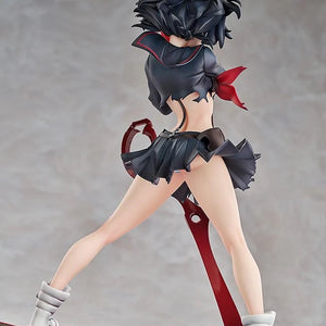 Rear view of the Ryuko Matoi figure, highlighting the dynamic flow of her skirt and hair, and the back of the Scissor Blade on the base.