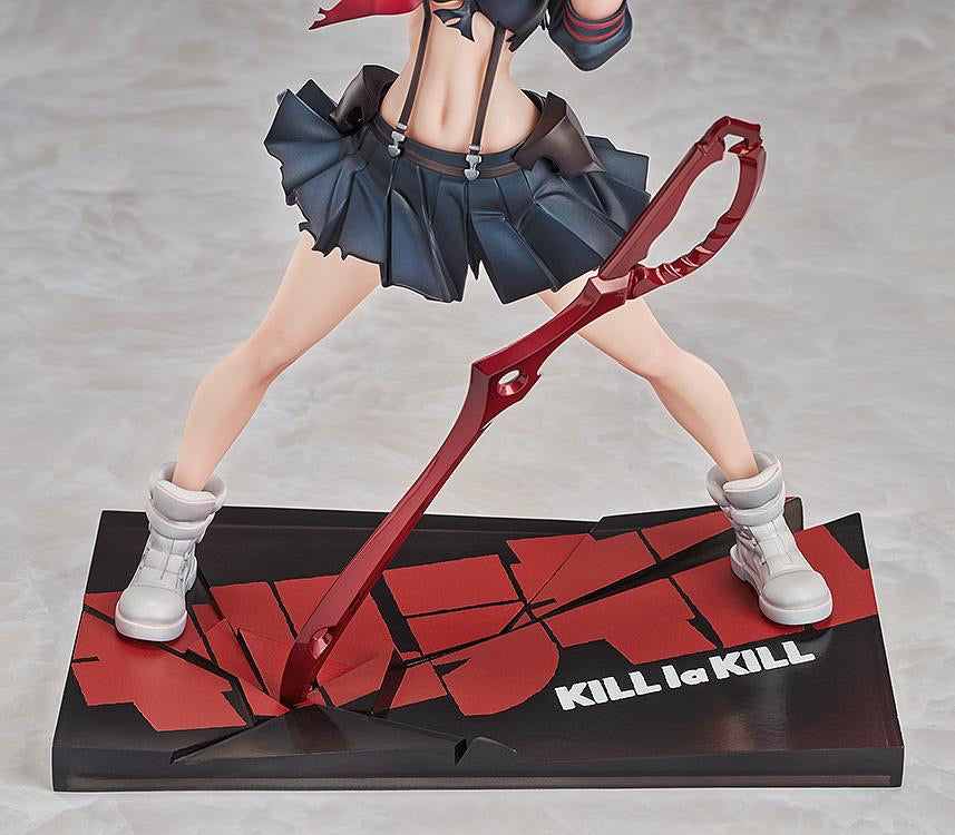 A close-up of the figure's legs, white boots, and the custom base featuring the cracked KILL la KILL logo design.