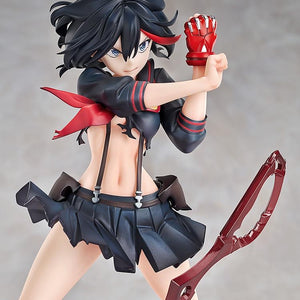 A close-up of the Ryuko Matoi figure's upper body, showing the detailed red accents of the uniform and her aggressive expression.