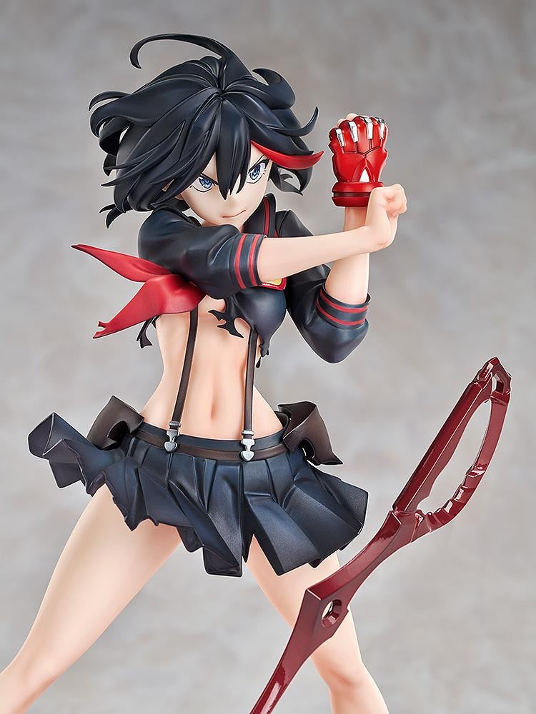 A close-up of the Ryuko Matoi figure's upper body, showing the detailed red accents of the uniform and her aggressive expression.